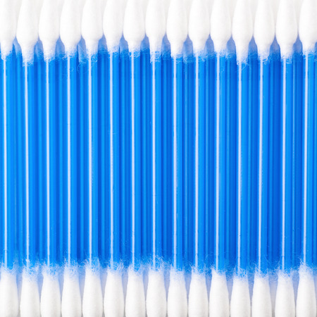 Surface covered with blue cotton swab buds, close-up crop fragment as a background compositionの写真素材