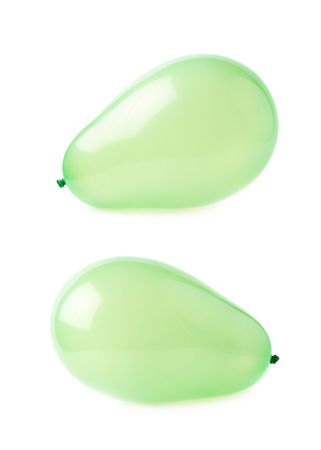 Inflated green air balloons isolated over the white background, set collection of two different foreshorteningsの写真素材