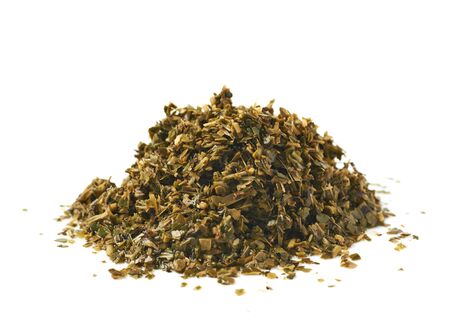 Pile of wet mate tea leaves isolated over the white backgroundの写真素材