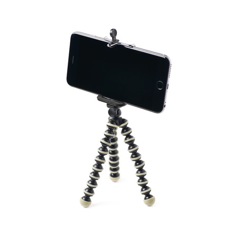Smartphone set up on a tripod isolated over the white backgroundの写真素材