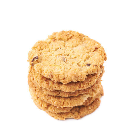 Pile stack of oatmeal cookies isolated over the white backgroundの写真素材