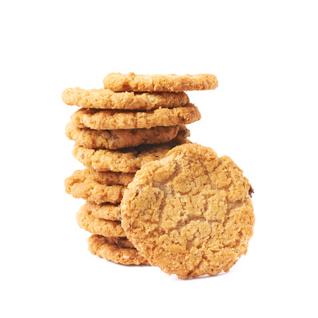 Pile stack of oatmeal cookies isolated over the white backgroundの写真素材