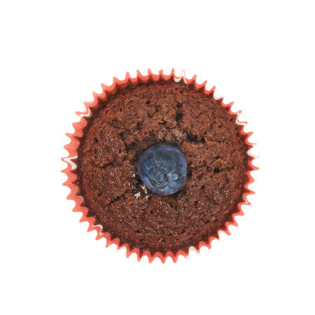 Chocolate muffin cupcake with the bilberry, isolated over the white backgroundの写真素材