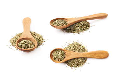 Wooden spoon full of dried rosmarinus seasoning isolated over the white background, set of three different foreshorteningsの写真素材