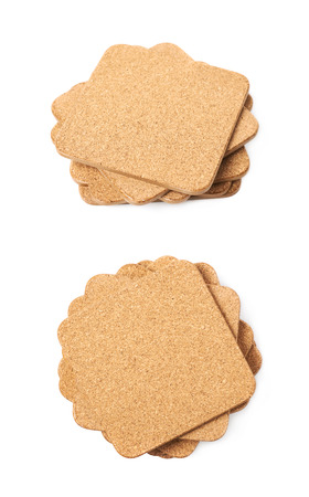 Pile of square cork textured drink's coasters isolated over the white background, set of two different foreshorteningsの写真素材