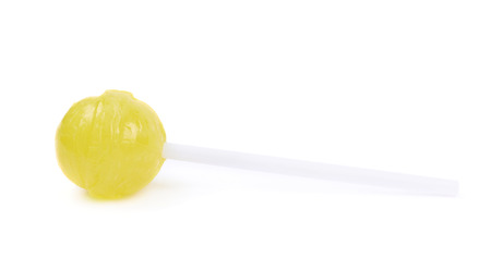 Yellow lollipop candy on a stick isolated over the white backgroundの写真素材