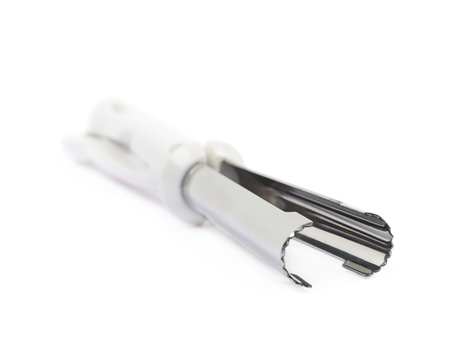 Cupcake corer tool for the core removal, isolated over the white background