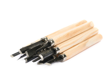 Pile of hand carving wood chisel tools, composition isolated over the white background