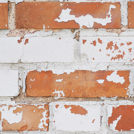 Close-up fragment of an old brick wall as a background texture composition