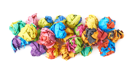 Pile of colorful crumbled paper balls, composition isolated over the white backgroundの写真素材