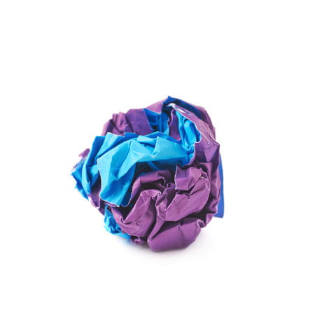 Colorful crumbled paper ball isolated over the white backgroundの写真素材