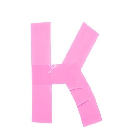 Letter K symbol made of insulating tape pieces, isolated over the white backgroundの写真素材