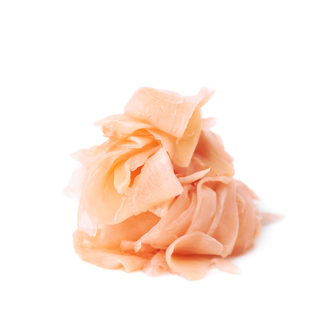 Pile of marinated ginger slices isolated over the white backgroundの写真素材