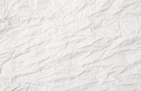 Crumbled paper sheet as a backdrop background composition textureの写真素材