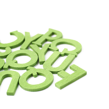 Pile of painted wooden letters isolated over the white backgroundの写真素材