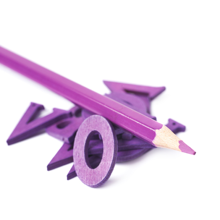 Pile of painted wooden letters with the drawing pencil over it, composition isolated over the white backgroundの写真素材