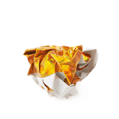 Crumbled ball of colorful origami paper sheet isolated over the white backgroundの写真素材