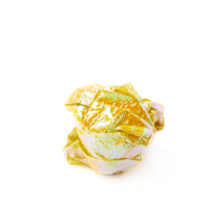 Crumbled ball of colorful origami paper sheet isolated over the white backgroundの写真素材