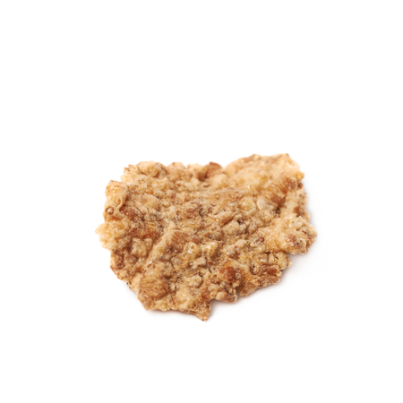 Single wholegrain cereal flake isolated over the white backgroundの写真素材