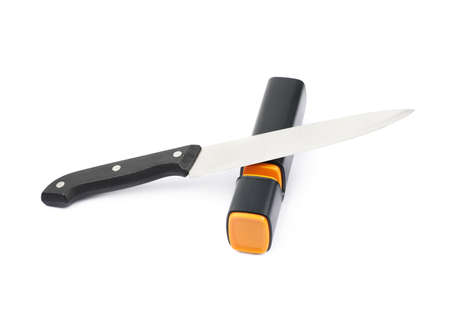 Knife in a plastic black sharpener tool, composition isolated over the white backgroundの写真素材