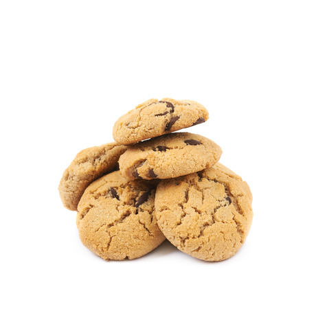 Pile of multiple soft chewy chocolate chip cookies isolated over the white background