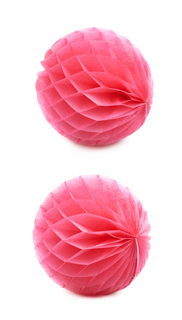 Red honeycomb pom-pom paper ball decoration isolated over the white background, set of two different foreshorteningsの写真素材