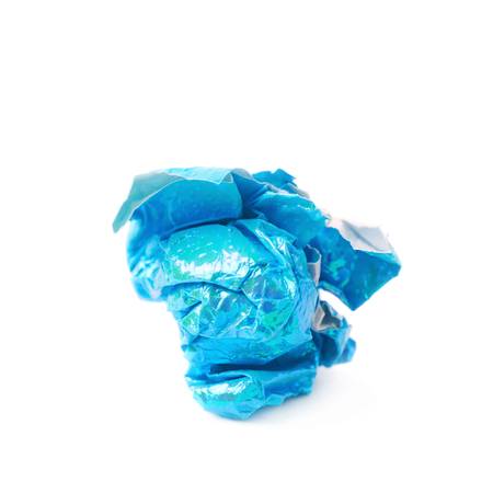 Crumbled ball of colorful origami paper sheet isolated over the white backgroundの写真素材