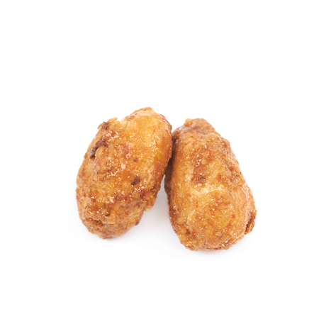 Two spice and sugar coated peanuts isolated over the white backgroundの写真素材