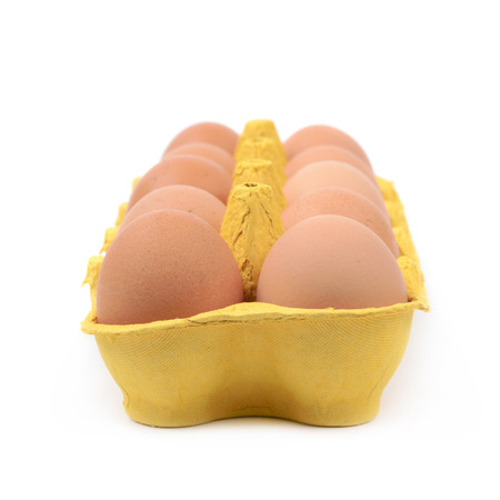 Yellow egg carton case isolated over the white background