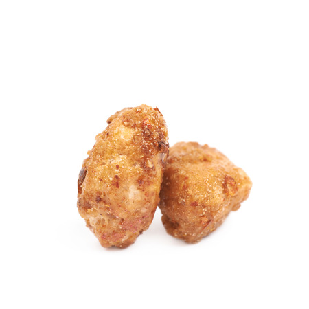 Two spice and sugar coated peanuts isolated over the white backgroundの写真素材