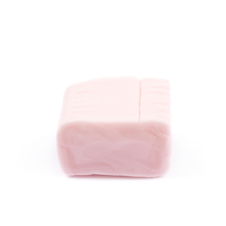 Chewing cuboid-shaped candy gum isolated over the white backgroundの写真素材