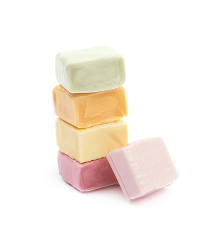 Pile of multiple colorful chewing cuboid-shaped candy gums isolated over the white backgroundの写真素材