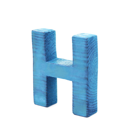 Single sawn wooden letter H symbol coated with paint isolated over the white backgroundの写真素材