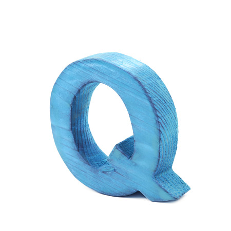 Single sawn wooden letter Q symbol coated with paint isolated over the white backgroundの写真素材