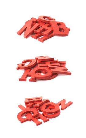 Pile of colorful paint coated wooden letters isolated over the white background, set of three different foreshorteningsの写真素材