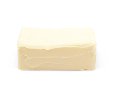 Piece of cooking butter isolated over the white backgroundの写真素材