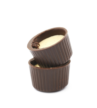 Composition of two chocolate confection candies isolated over the white backgroundの写真素材