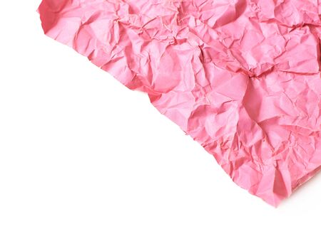 Fragment of a crumpled origami paper sheet isolated over the white background, close-up crop composition as a copyspace backdrop with a shallow depth of fieldの写真素材