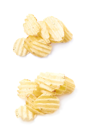 Pile of multiple seasoned potato chips crisps, composition isolated over the white background, set of two different foreshorteningsの写真素材