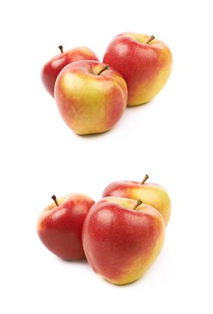 Composition of multiple ripe red and golden jonagold apples isolated over the white background, set of two different foreshorteningsの写真素材