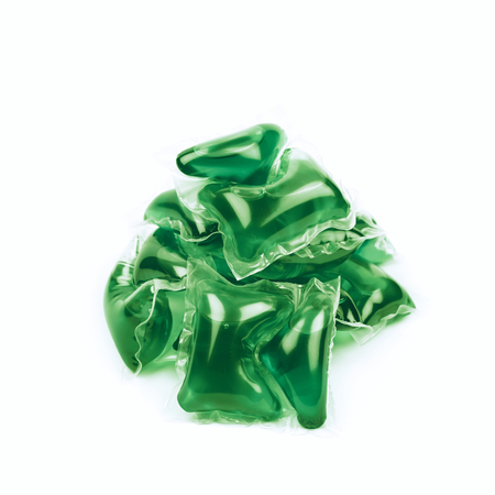 Pile of multiple washing pod capsules isolated over the white backgroundの写真素材