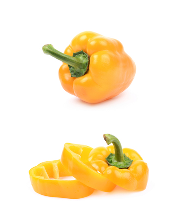 Pile of a yellow bell pepper slices isolated over the white background, set of two different foreshorteningsの写真素材