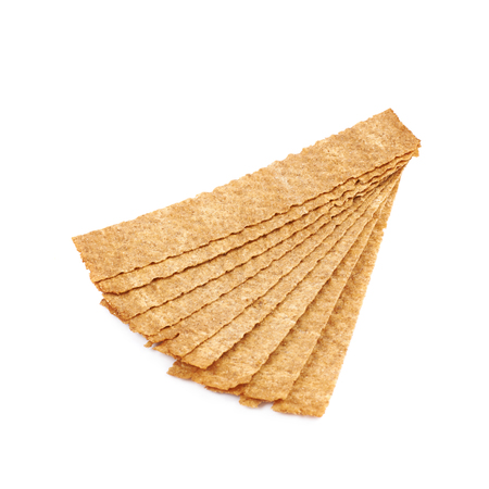 Pile of crispy brown and rectangle shaped bread chips isolated over the white background