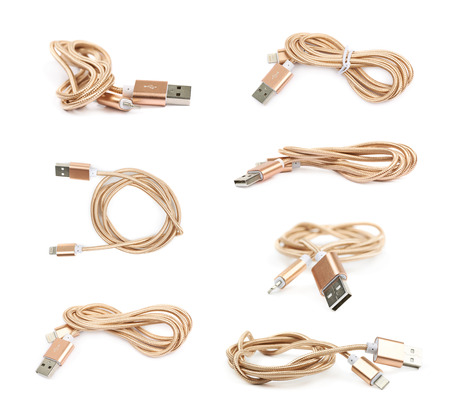 Folded USB lightning golden cable isolated over the white background, set of multiple different...