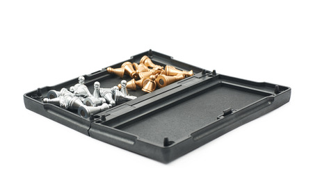 Opened chess board box with the figures inside of it, composition isolated over the white background