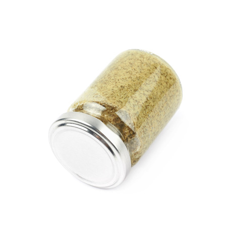 Glass jar of italian pesto isolatedの写真素材