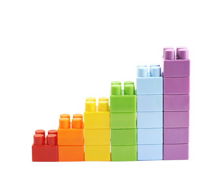 Growing stacks of toy bricks isolated