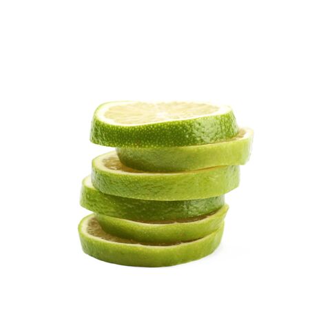 Pile of multiple lime slices isolatedの写真素材