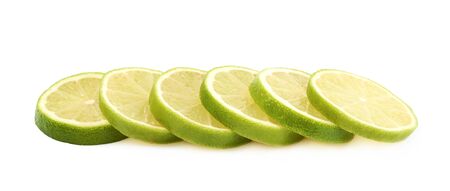 Pile of multiple lime slices isolatedの写真素材