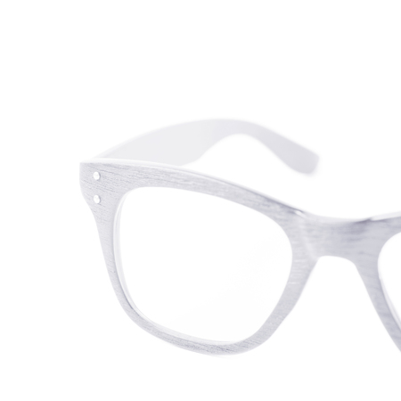 Pair of wooden textured optical reading glasses isolated over the white background, close-up crop foreshorteningの写真素材